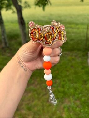 Custom OBGYN Glitter Badge Reel with Orange Bead Chain